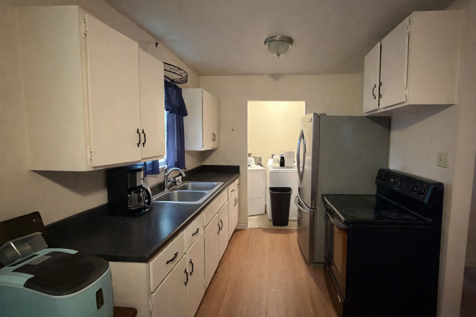 61 Hooker Shepherd, TX 77371 - Photo 7 of 17 a kitchen with stainless steel appliances a sink stove and refrigerator