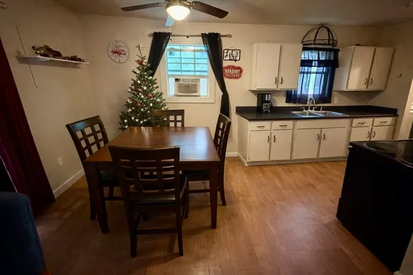 a dining room with furniture and window