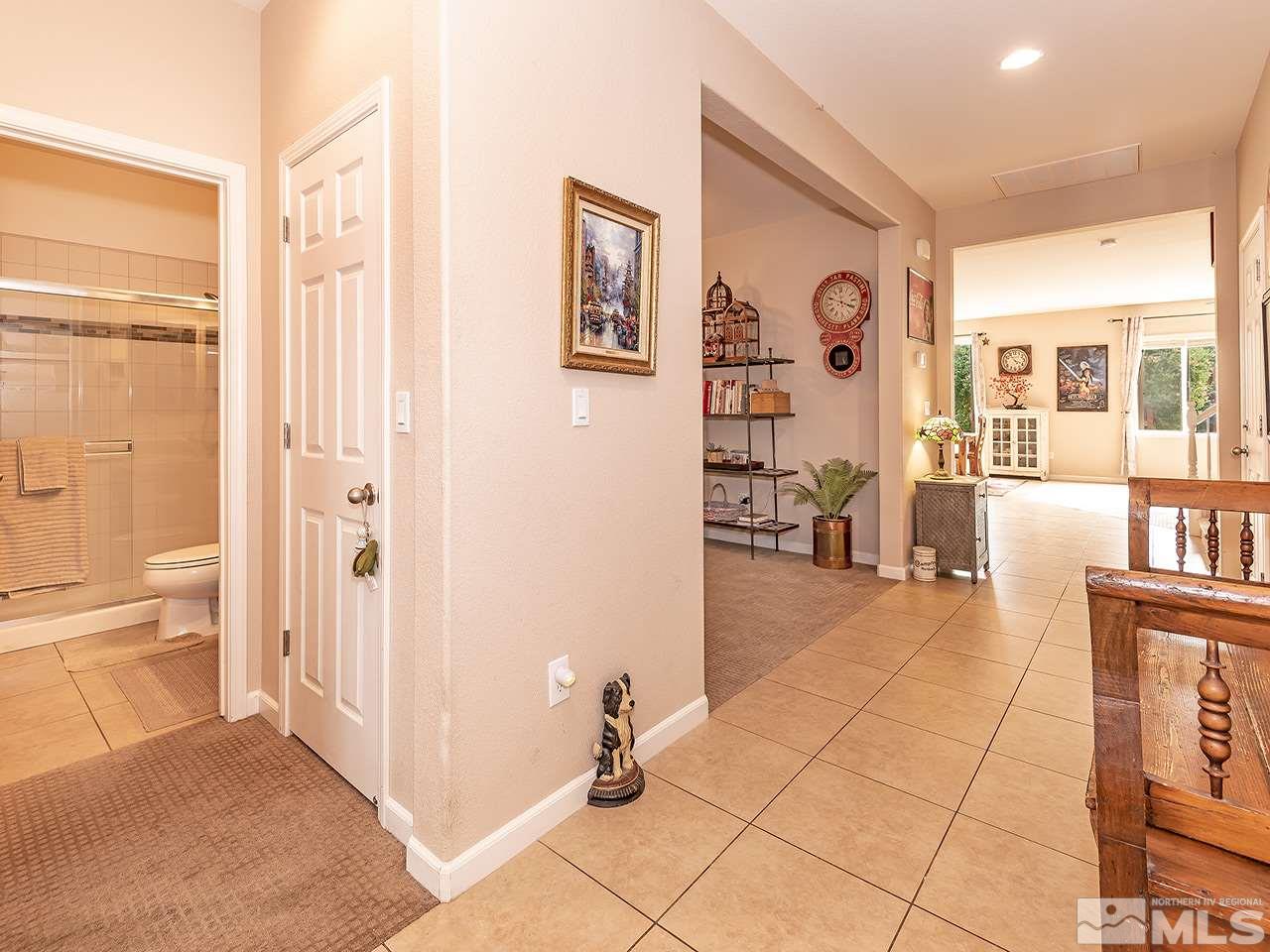 2030 Angel Ridge Drive Reno, NV 89521 - Photo 12 of 22 a view of a hallway with wooden floor and a living room