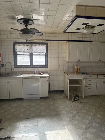 a kitchen with a sink and cabinets