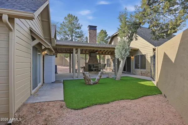 a view of a yard with a tree