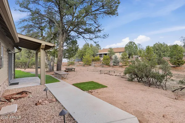 an aerial view of a house with outdoor space