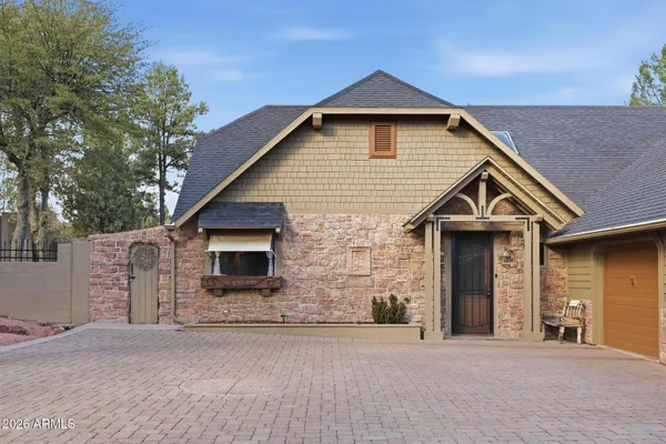 a dining hall with stainless steel appliances kitchen island granite countertop a dining table and chairs
