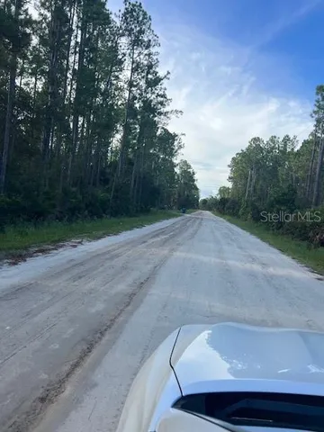a view of a car parked on the side of the road