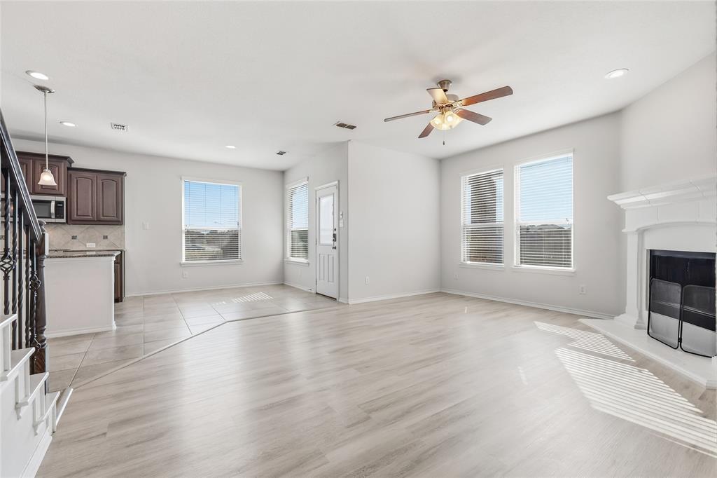 11301 Golden Ridge Lane Haslet, TX 76052 - Photo 16 of 35 a view of an empty room with a window and fireplace