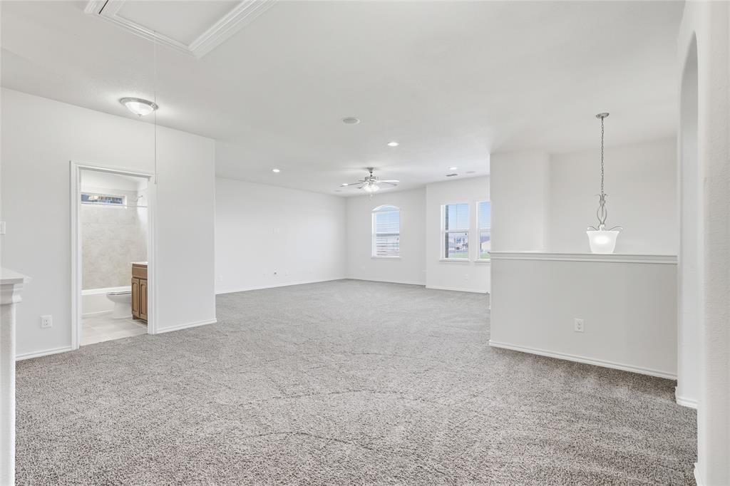 11301 Golden Ridge Lane Haslet, TX 76052 - Photo 22 of 35 a view of an empty room with kitchen and window