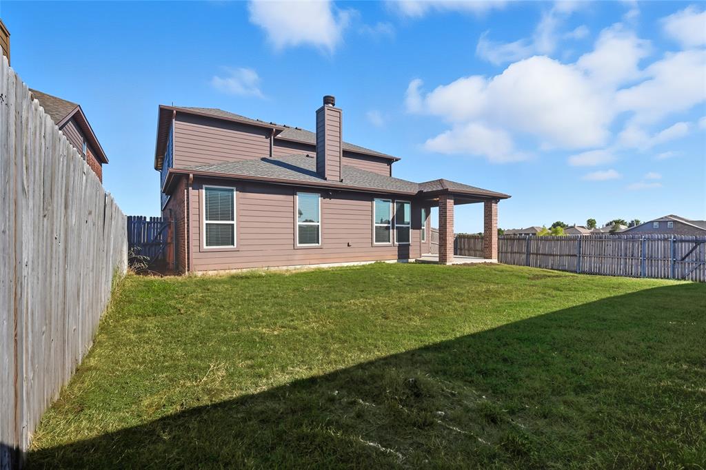 11301 Golden Ridge Lane Haslet, TX 76052 - Photo 31 of 35 a front view of a house with garden