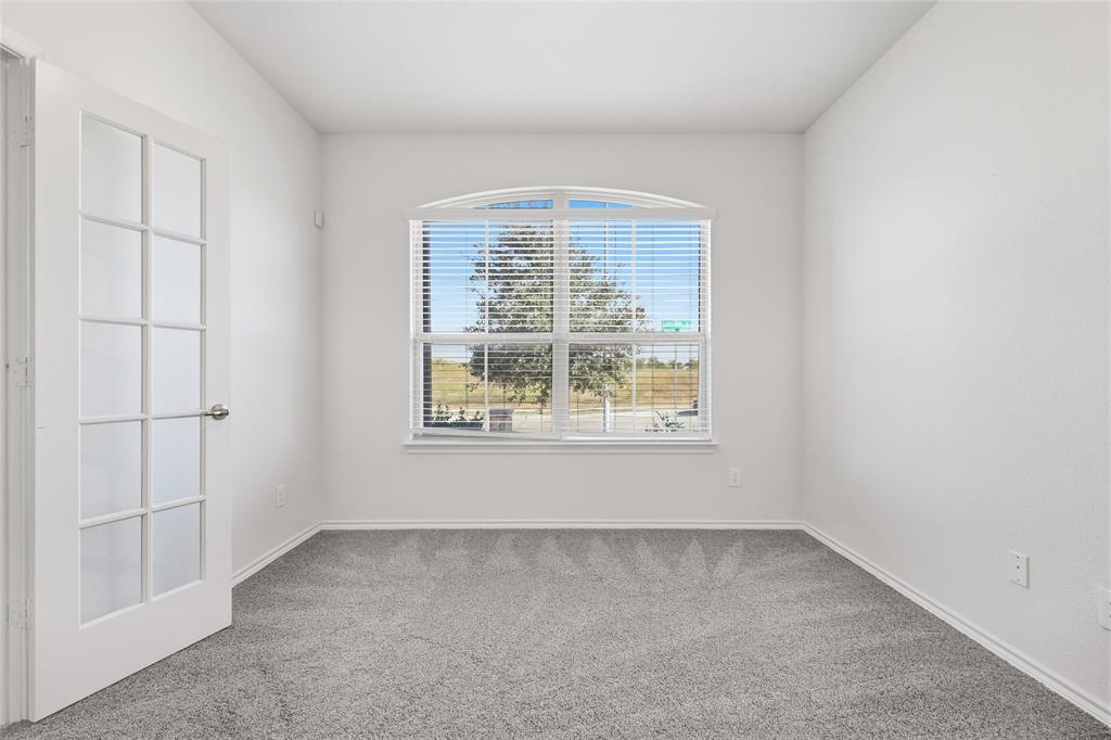 11301 Golden Ridge Lane Haslet, TX 76052 - Photo 6 of 35 an empty room with a window