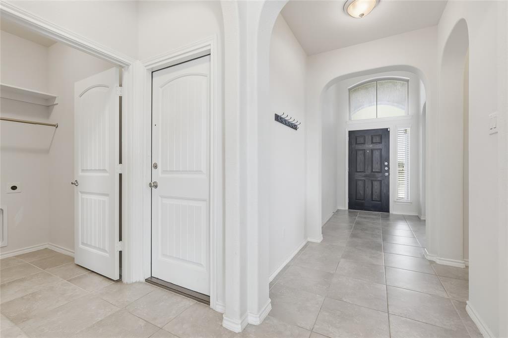 11301 Golden Ridge Lane Haslet, TX 76052 - Photo 7 of 35 a view of a hallway with wooden shelves
