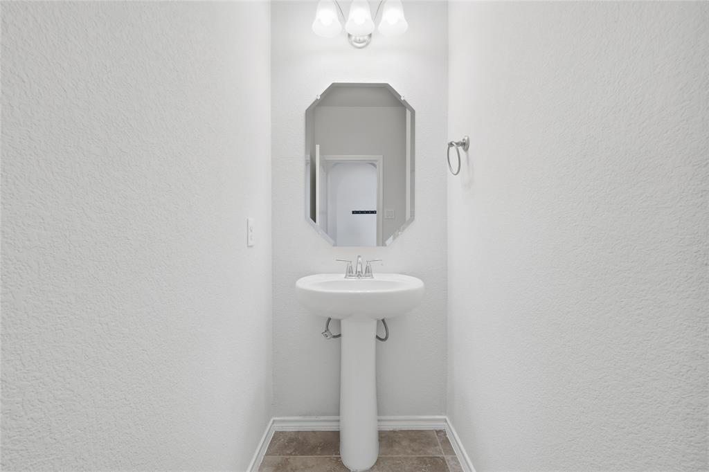 11301 Golden Ridge Lane Haslet, TX 76052 - Photo 8 of 35 a bathroom with a sink and a mirror