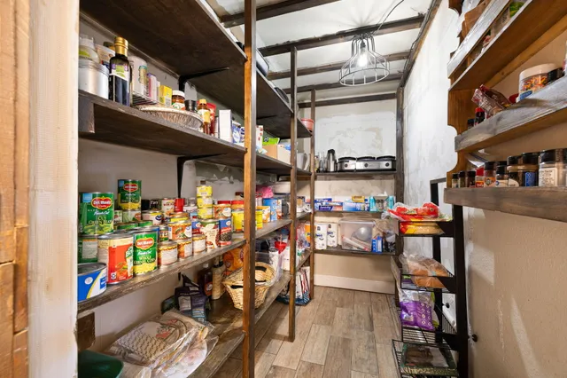 a view of a porch with furniture and a yard