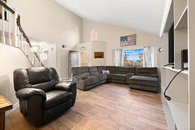 a view of a balcony with wooden floor