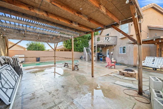 a living room with furniture and stairs