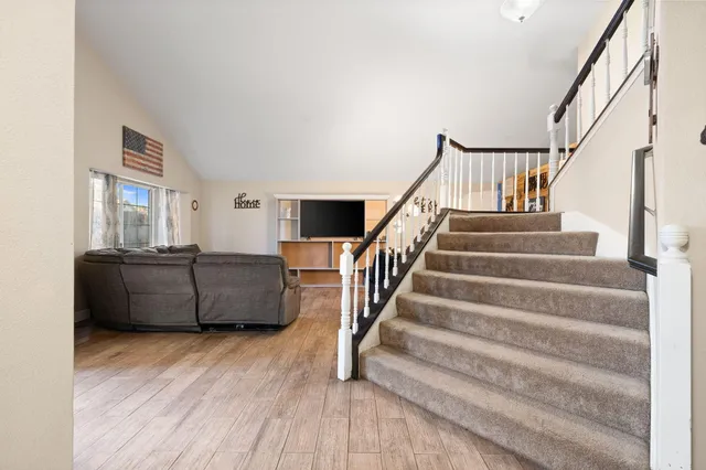 a bedroom with furniture and a window