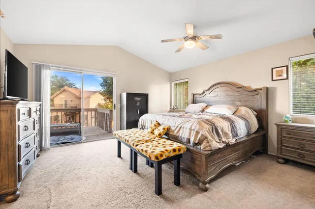 a bathroom with a toilet a sink a mirror and vanity
