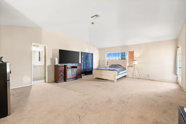 a view of a workspace with furniture