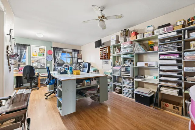 a view of a patio with table and chairs and potted plants