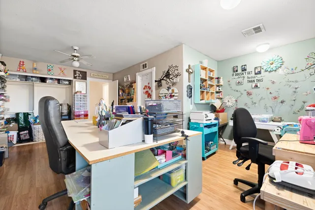 an aerial view of residential houses with outdoor space and ocean view