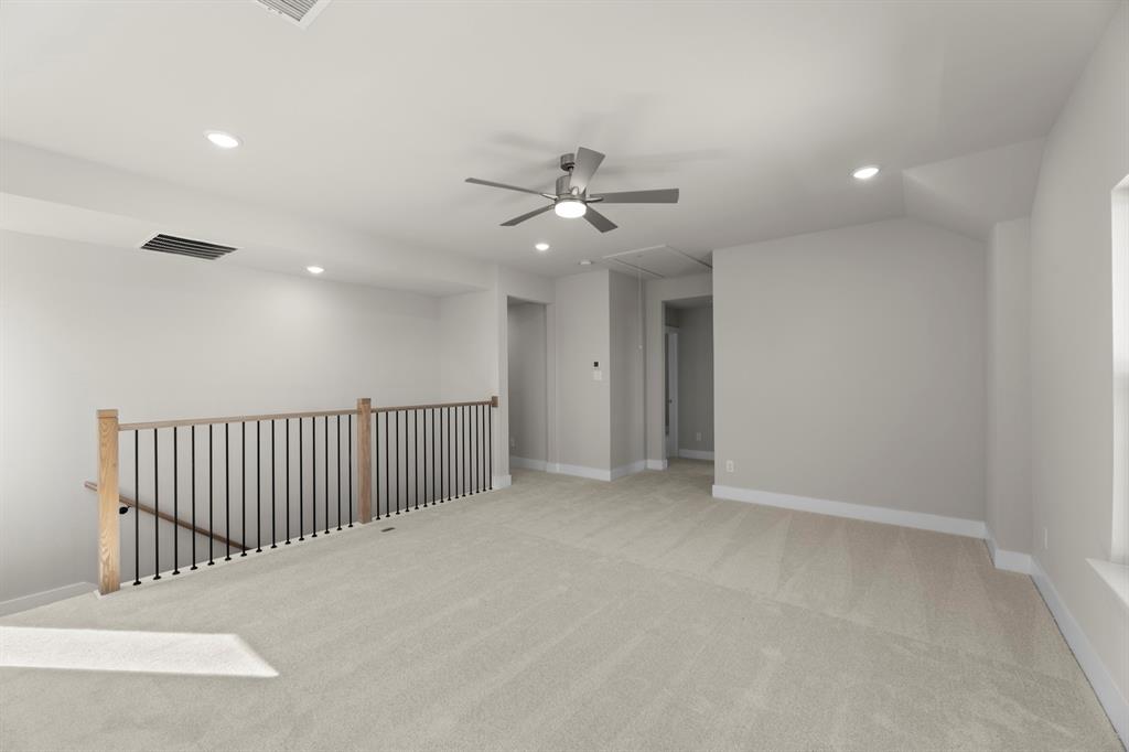 2359 Bell Way Forney, TX 75126 - Photo 23 of 31 an empty room with chandelier fan and windows