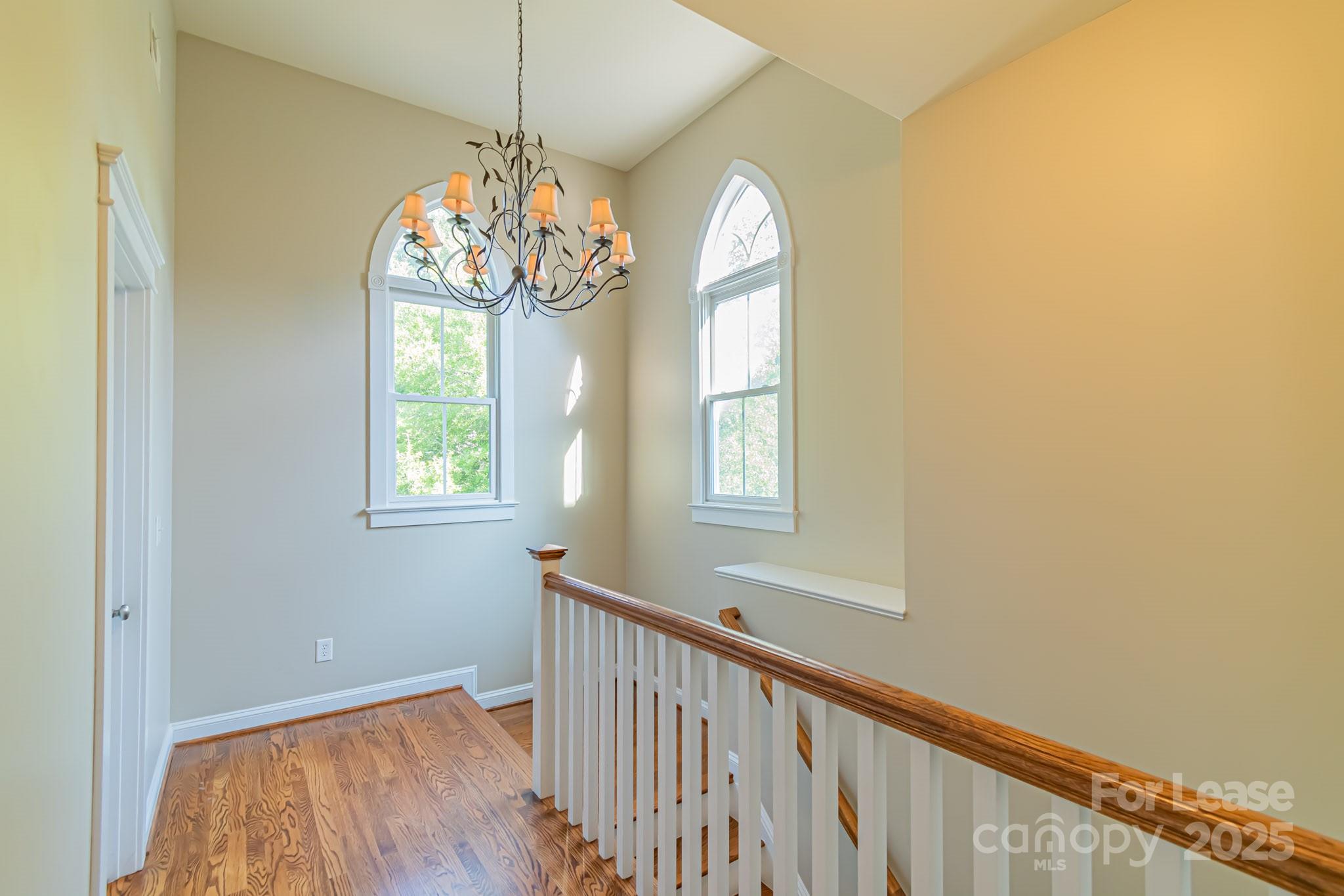 742 Revival Row Fort Mill, SC 29708 - Photo 14 of 32 a view of a room with wooden floor and windows