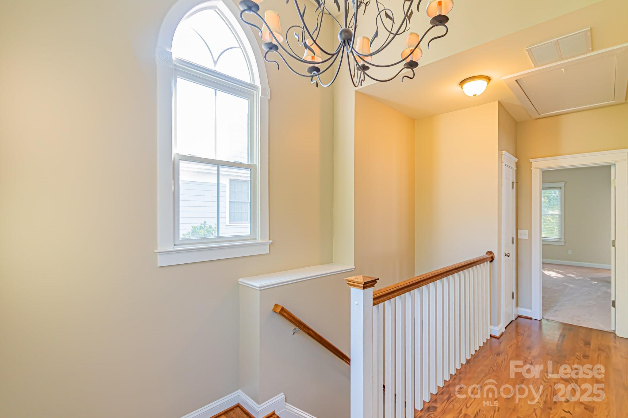 742 Revival Row Fort Mill, SC 29708 - Photo 15 of 32 a view of a room with wooden floor and windows