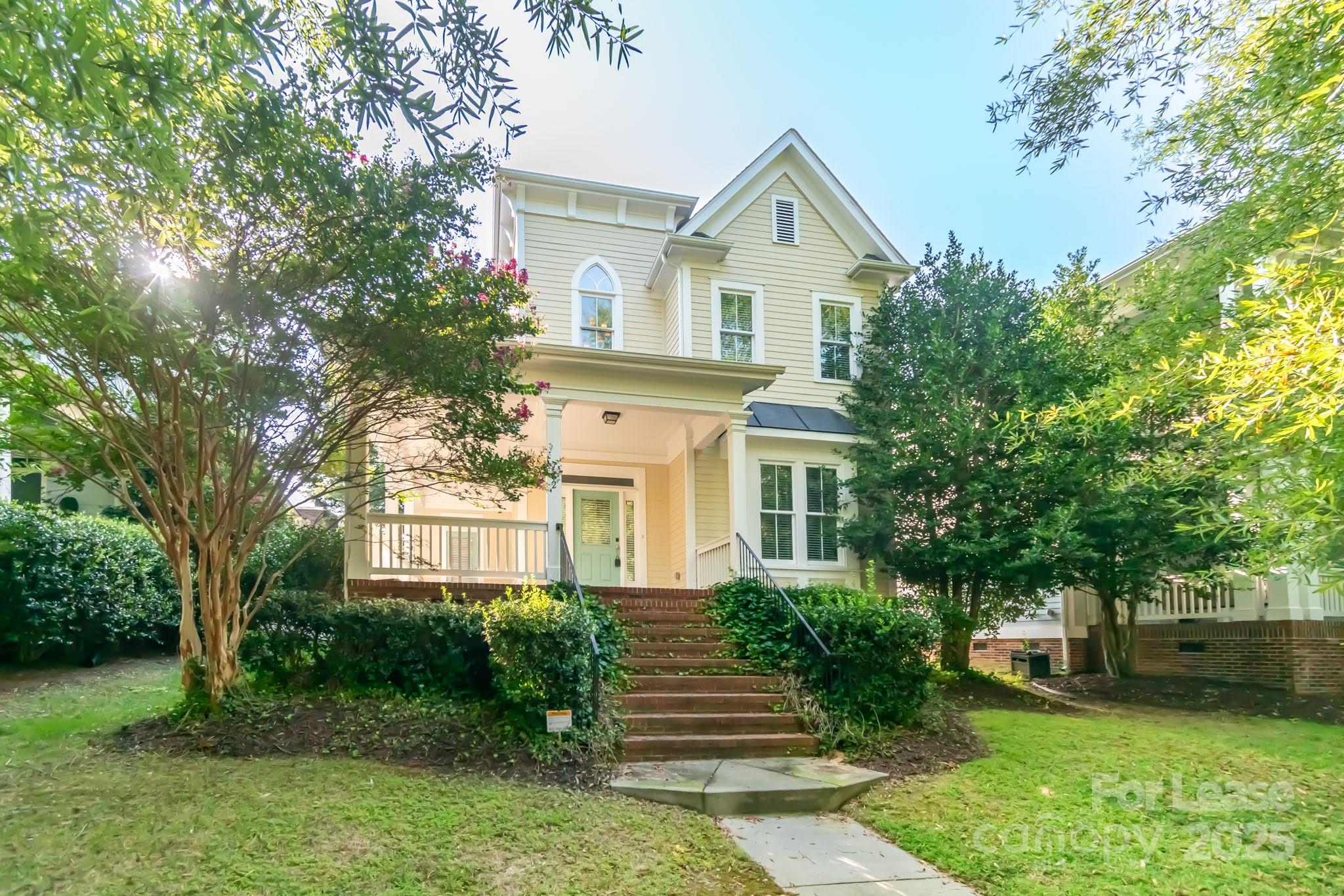 742 Revival Row Fort Mill, SC 29708 - Photo 2 of 32 a front view of a house with garden
