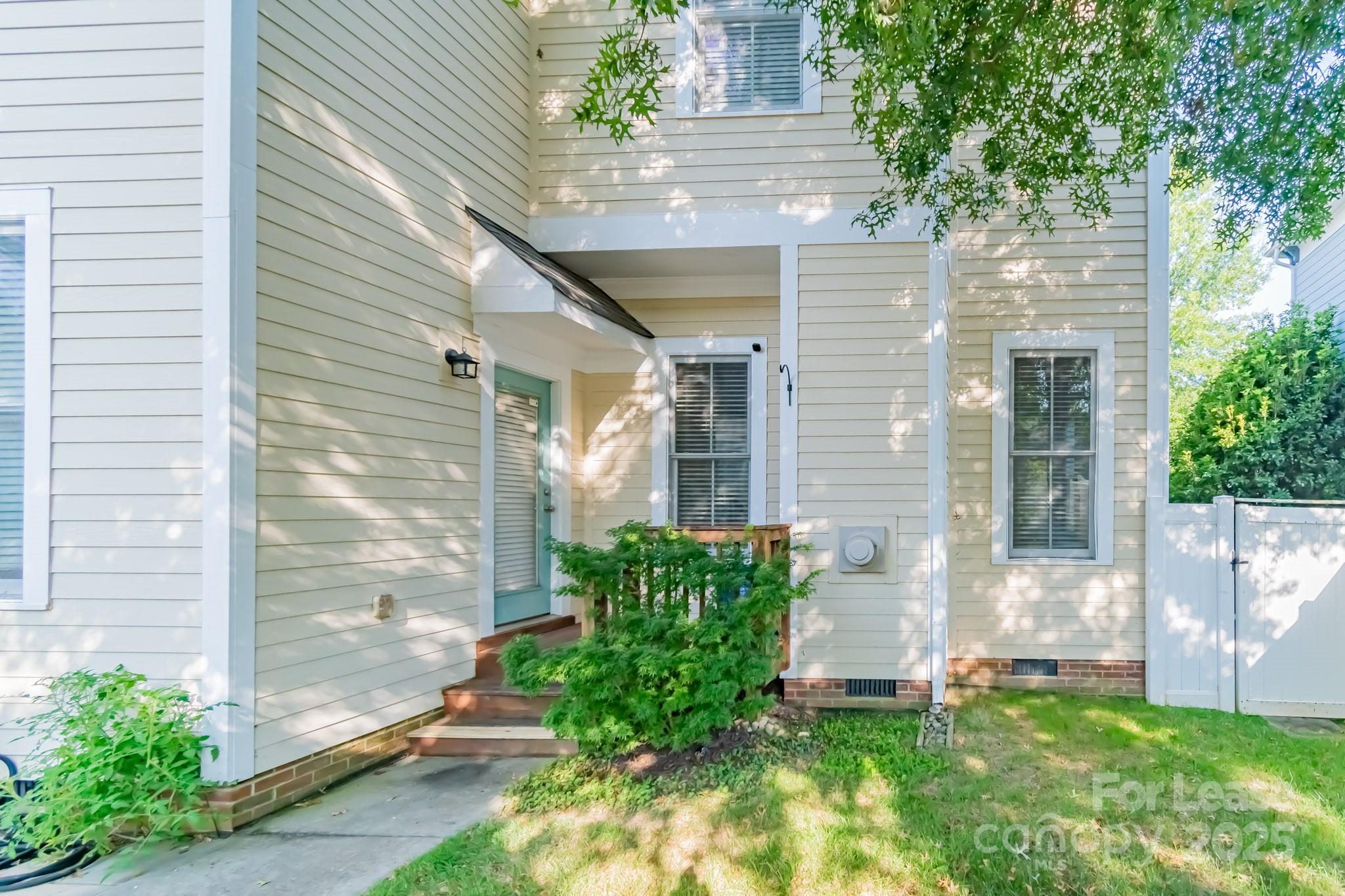742 Revival Row Fort Mill, SC 29708 - Photo 4 of 32 a view of a backyard with plants
