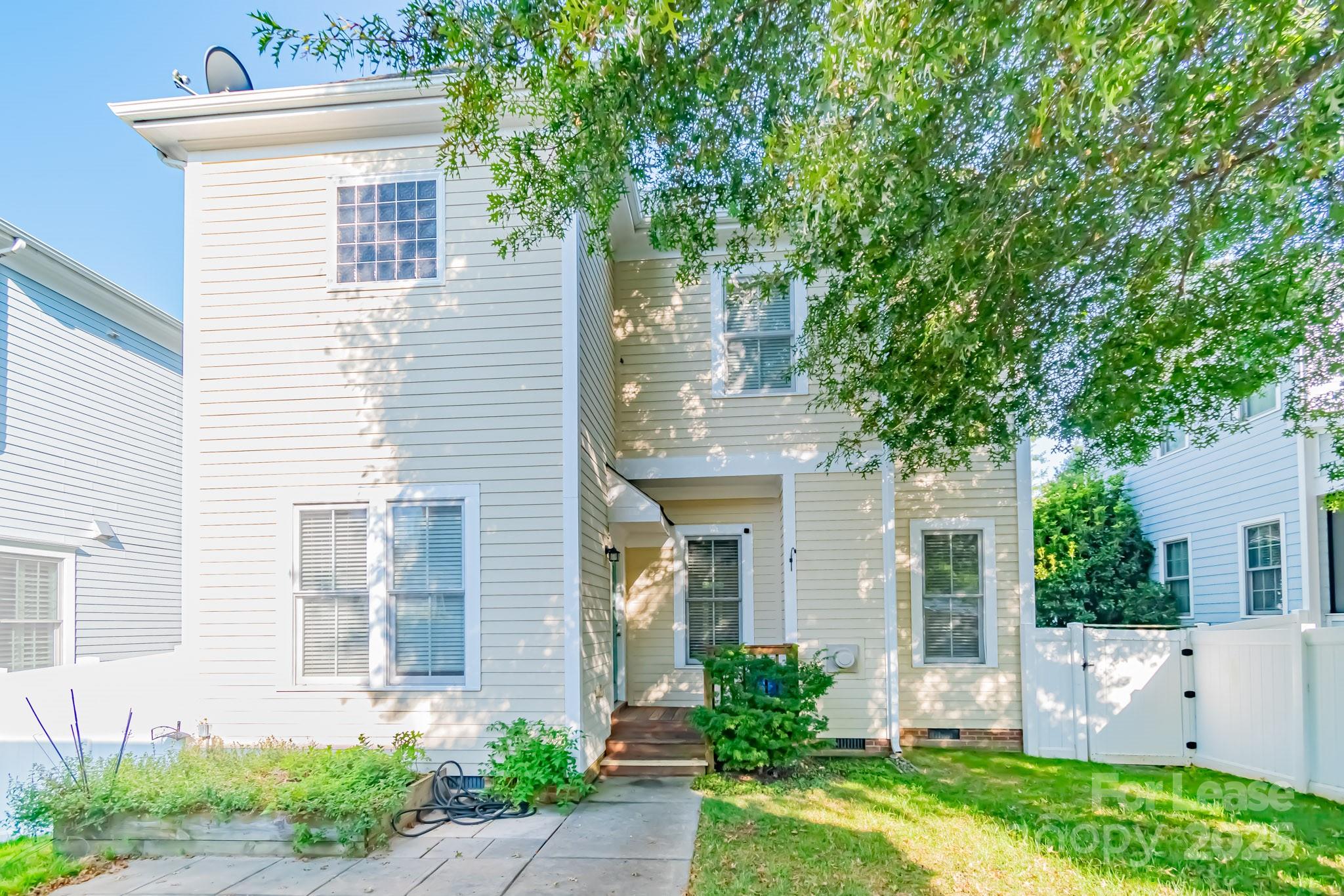 742 Revival Row Fort Mill, SC 29708 - Photo 5 of 32 a front view of a house with garden