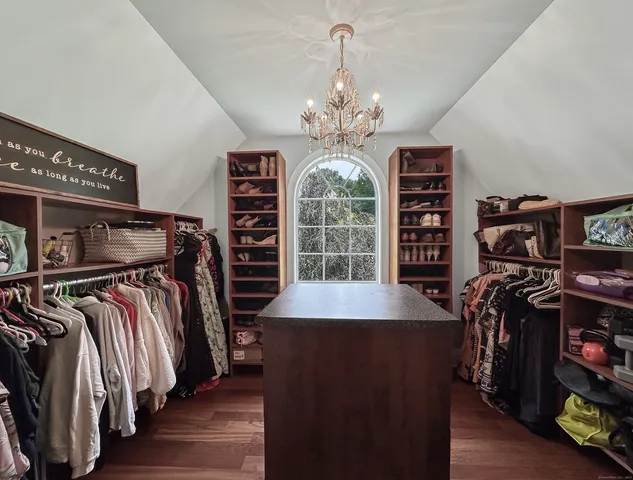 a view of a room with furniture and window