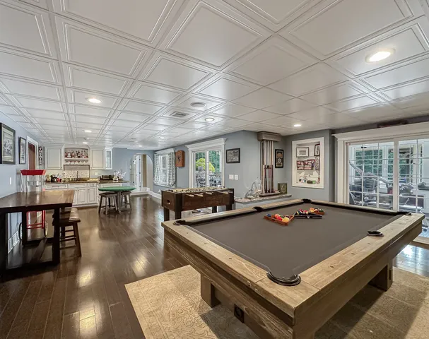 a media room with lots of chairs and a projector screen