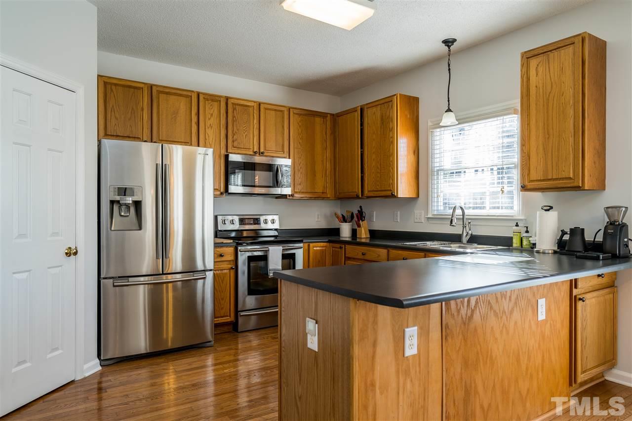 5221 Denmead Way Raleigh, NC 27613 - Photo 11 of 28 Clean kitchen with stainless steel appliances and open concept!