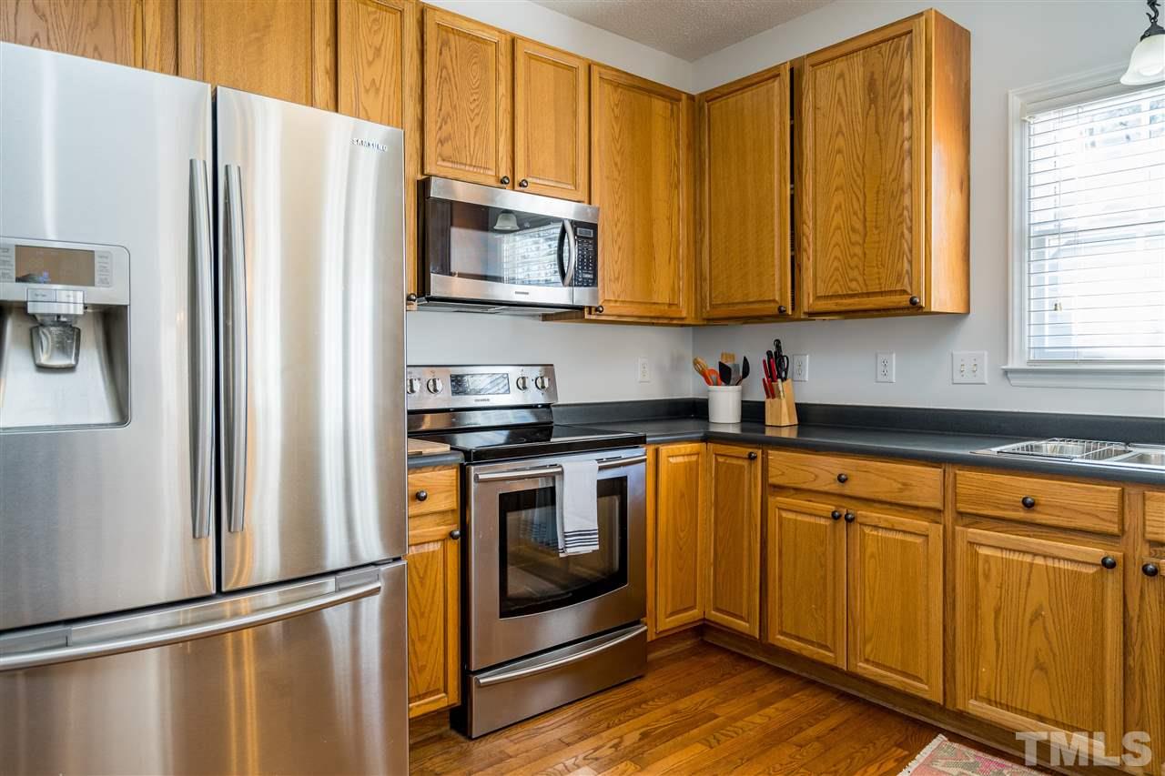 5221 Denmead Way Raleigh, NC 27613 - Photo 12 of 28 Clean kitchen with stainless steel appliances and open concept!