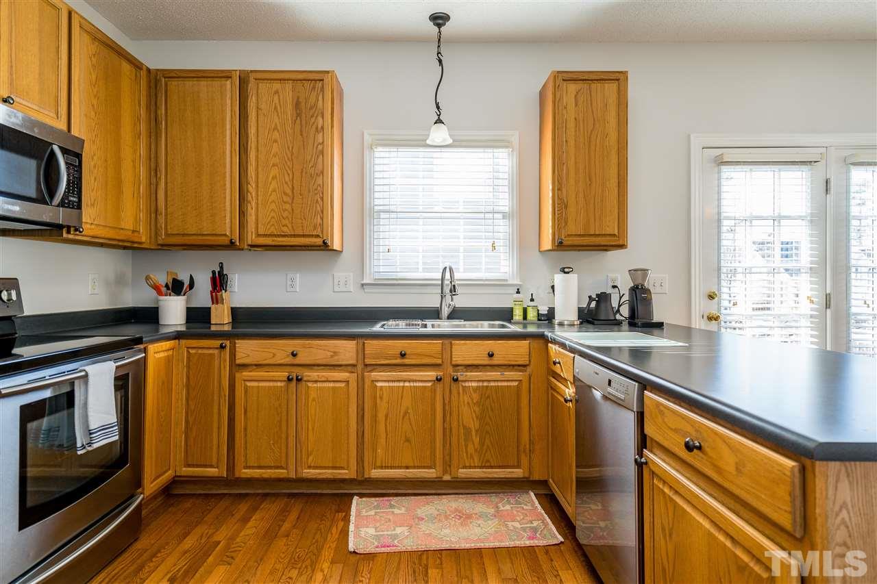 5221 Denmead Way Raleigh, NC 27613 - Photo 13 of 28 Clean kitchen with stainless steel appliances and open concept!