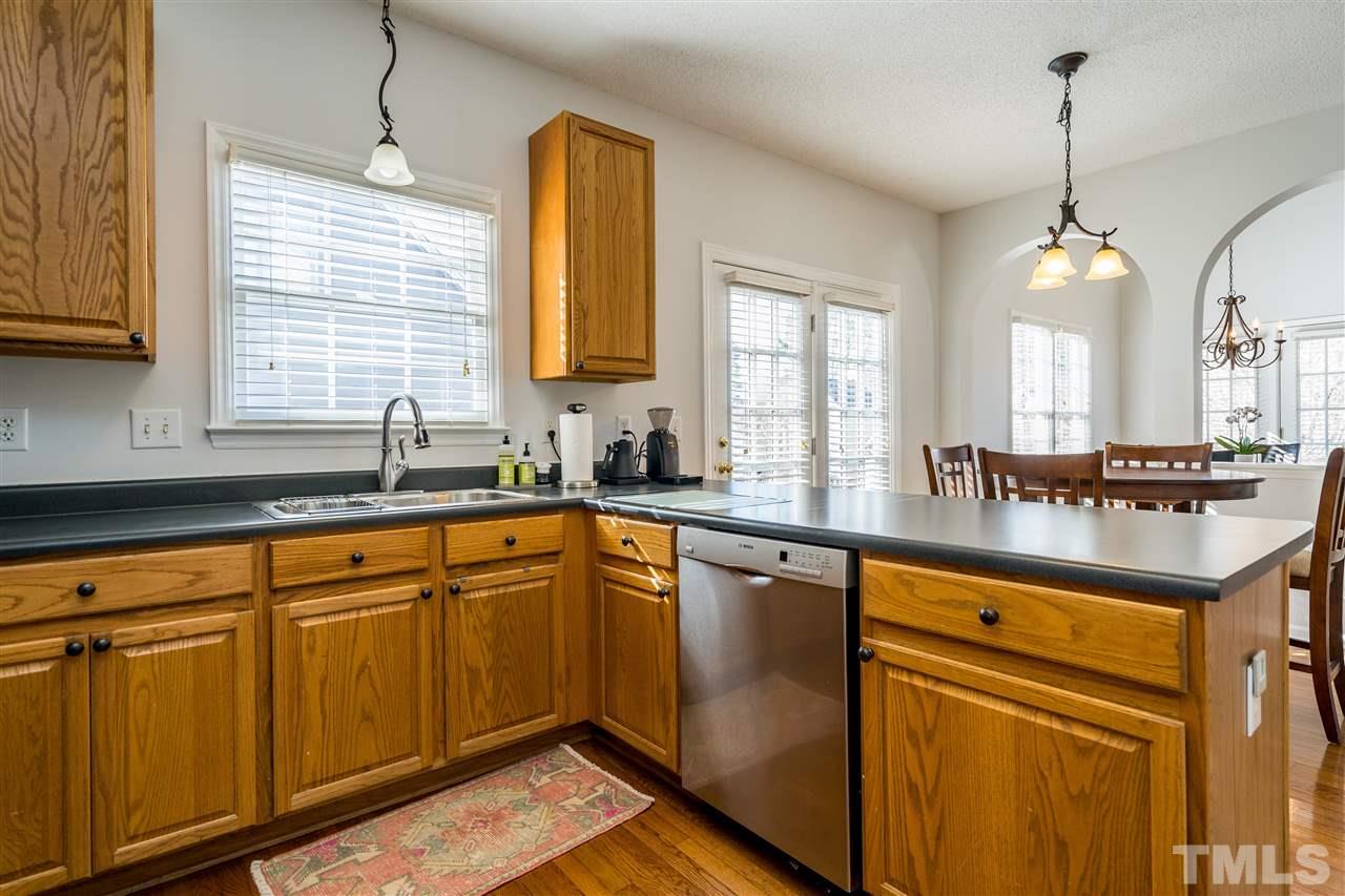 5221 Denmead Way Raleigh, NC 27613 - Photo 14 of 28 Clean kitchen with stainless steel appliances and open concept!