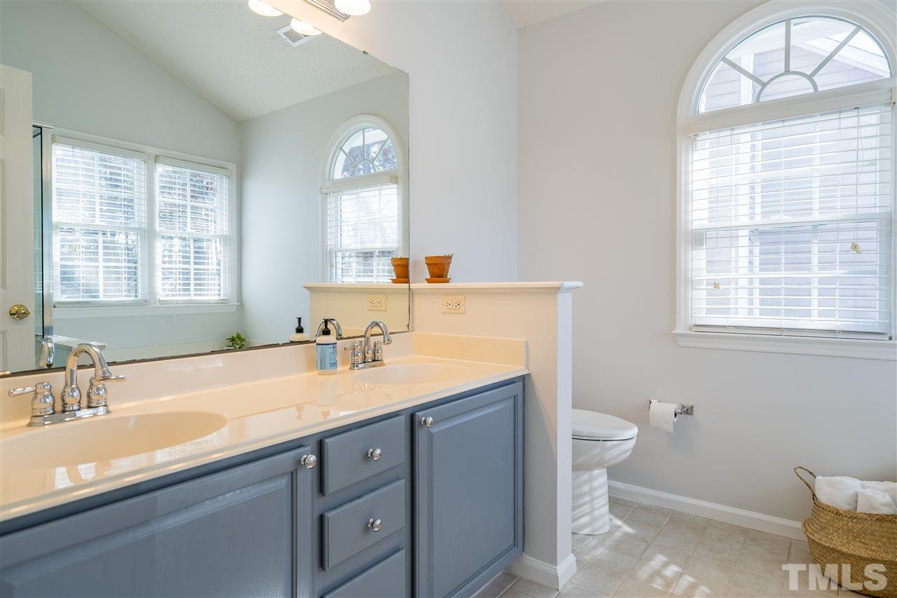5221 Denmead Way Raleigh, NC 27613 - Photo 20 of 28 Owner's suite bathroom with glass enclosed shower, garden tub and dual vanities!