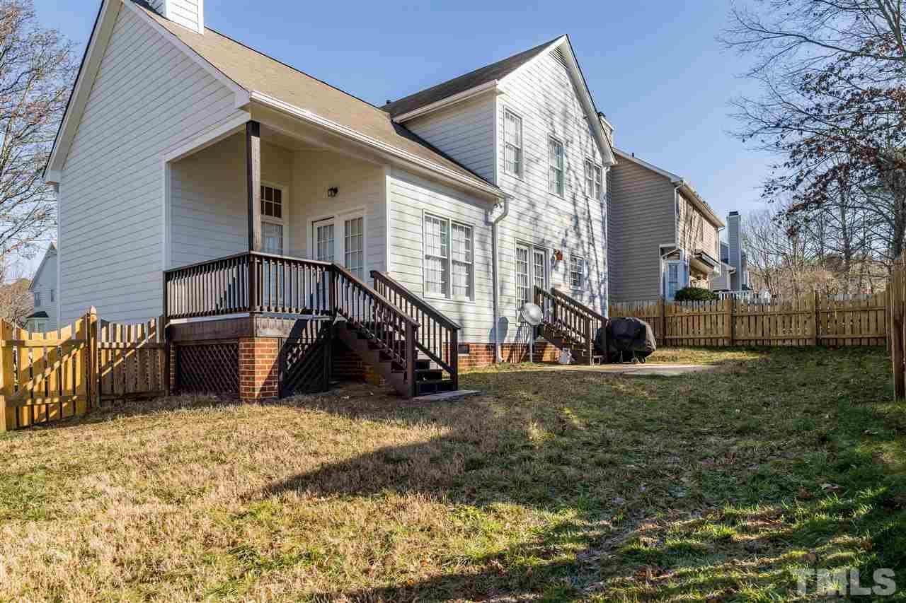 5221 Denmead Way Raleigh, NC 27613 - Photo 28 of 28 View of the lovely backyard with patio, fence and area to play!