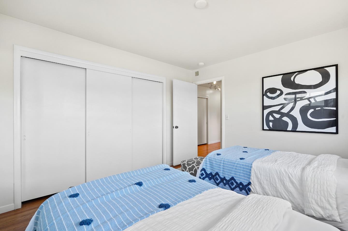 2805 Rivera Drive Burlingame, CA 94010 - Photo 19 of 28 a bed room with a bed and a painting on the wall