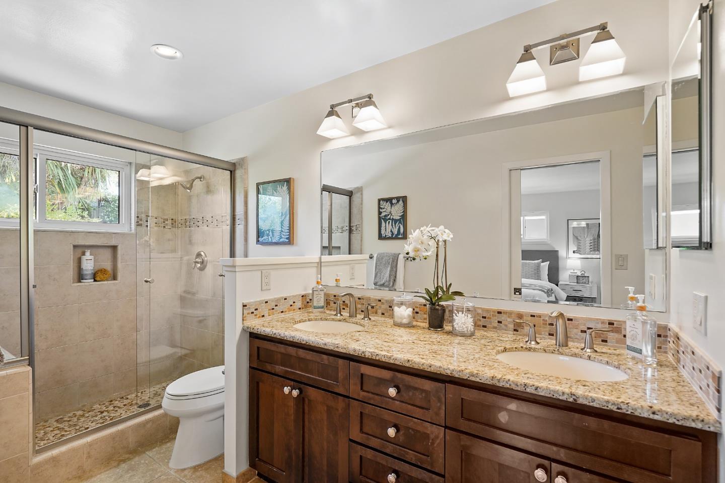 2805 Rivera Drive Burlingame, CA 94010 - Photo 22 of 28 a bathroom with a granite countertop double vanity sink a mirror and a toilet