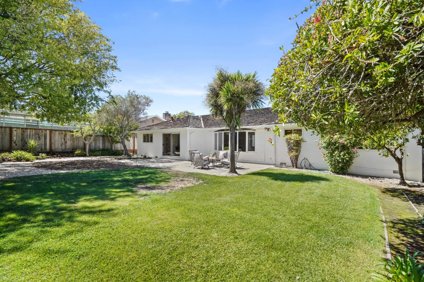 2805 Rivera Drive Burlingame, CA 94010 - Photo 25 of 28 a front view of a house with a yard and a garage