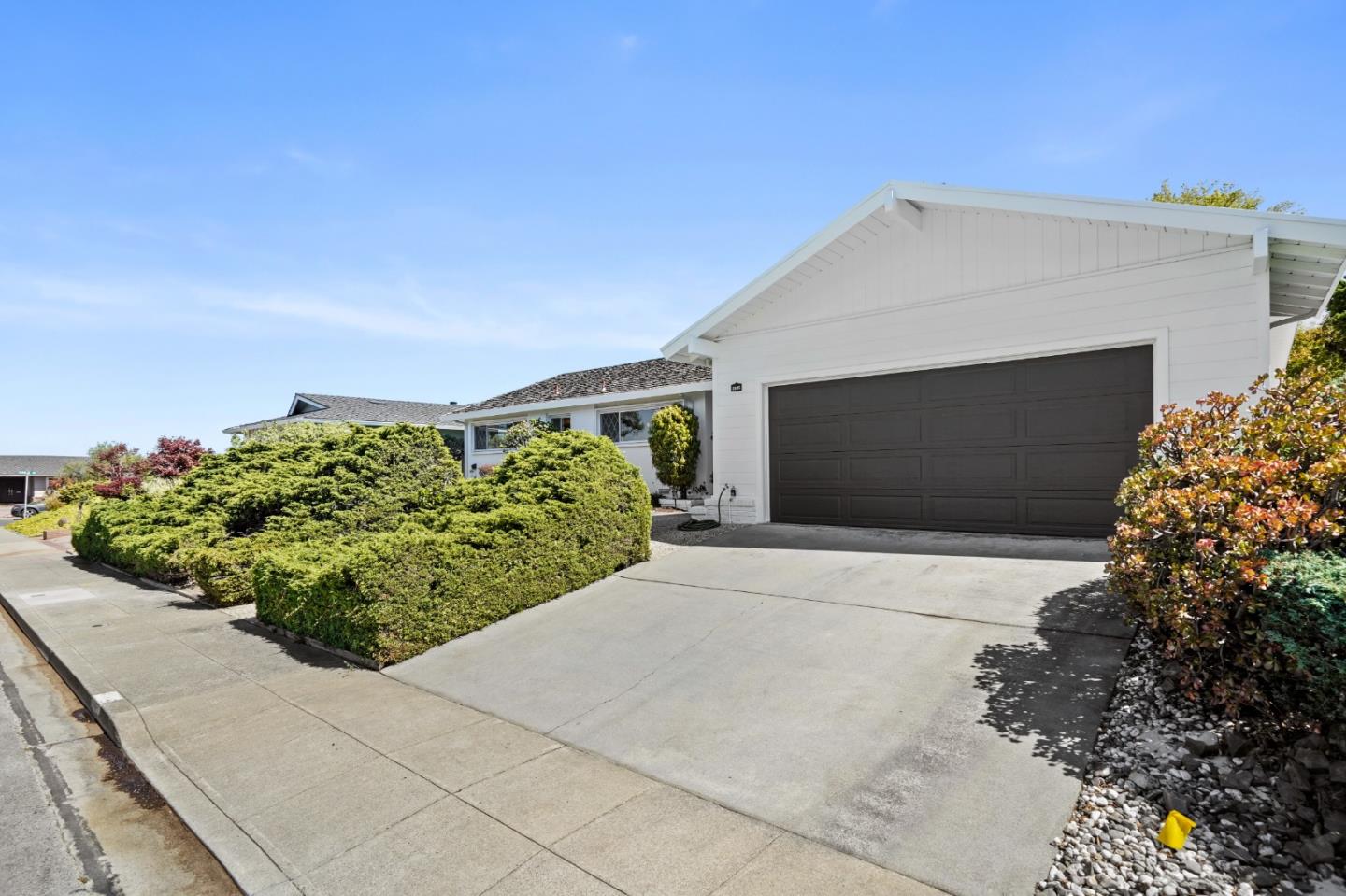 2805 Rivera Drive Burlingame, CA 94010 - Photo 28 of 28 a front view of a house with a yard and garage