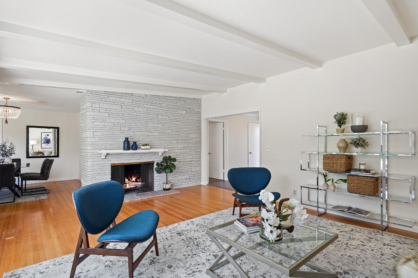 2805 Rivera Drive Burlingame, CA 94010 - Photo 6 of 28 a living room with furniture a rug and a fireplace