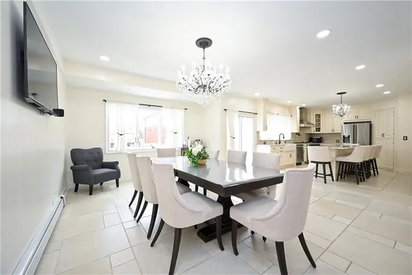a kitchen with a sink appliances and cabinets