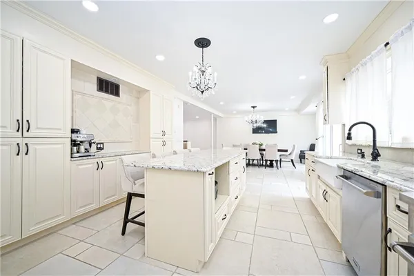 a large kitchen with a table and chairs