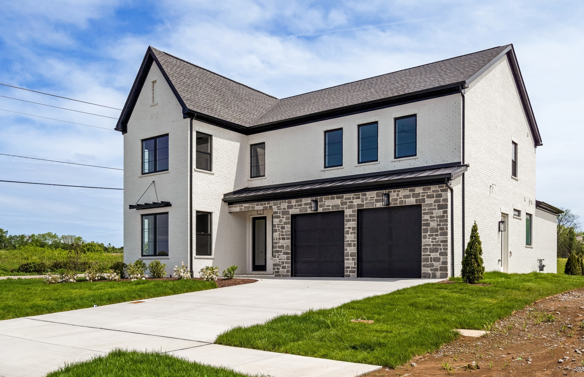 2000 Landry Place Franklin, TN 37064 - Photo 2 of 58 a front view of a house with a yard and garage