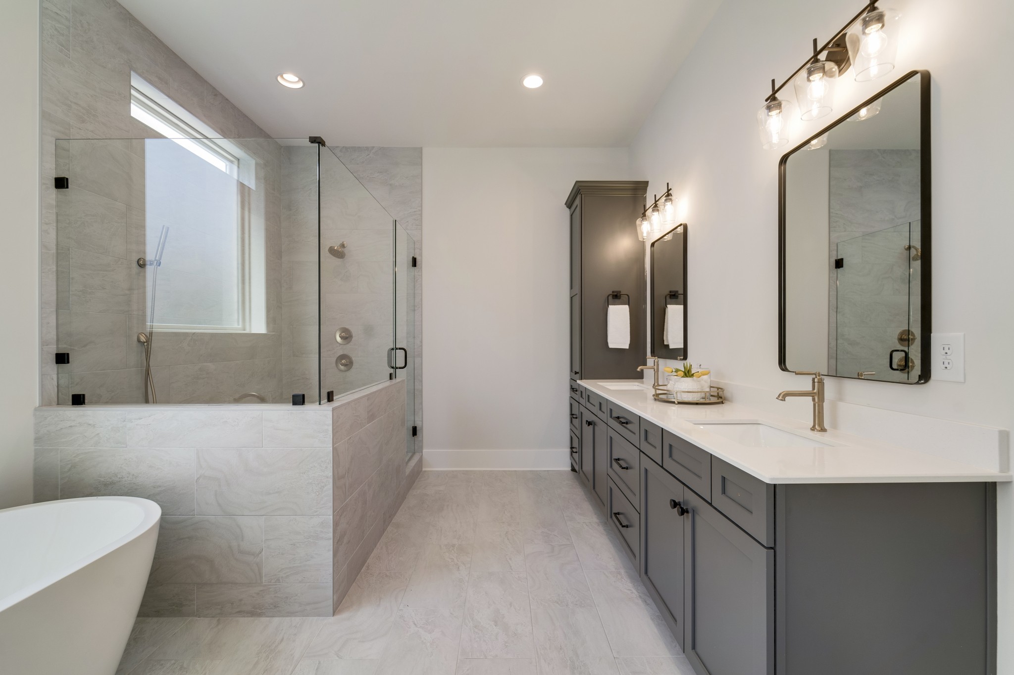 2000 Landry Place Franklin, TN 37064 - Photo 28 of 58 a spacious bathroom with double vanity sinks a large mirror and a shower