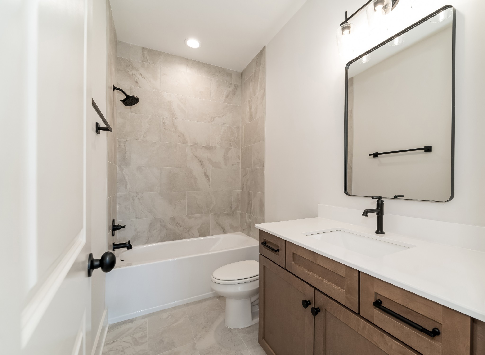 2000 Landry Place Franklin, TN 37064 - Photo 40 of 58 a bathroom with a toilet a sink a mirror a bathtub and vanity