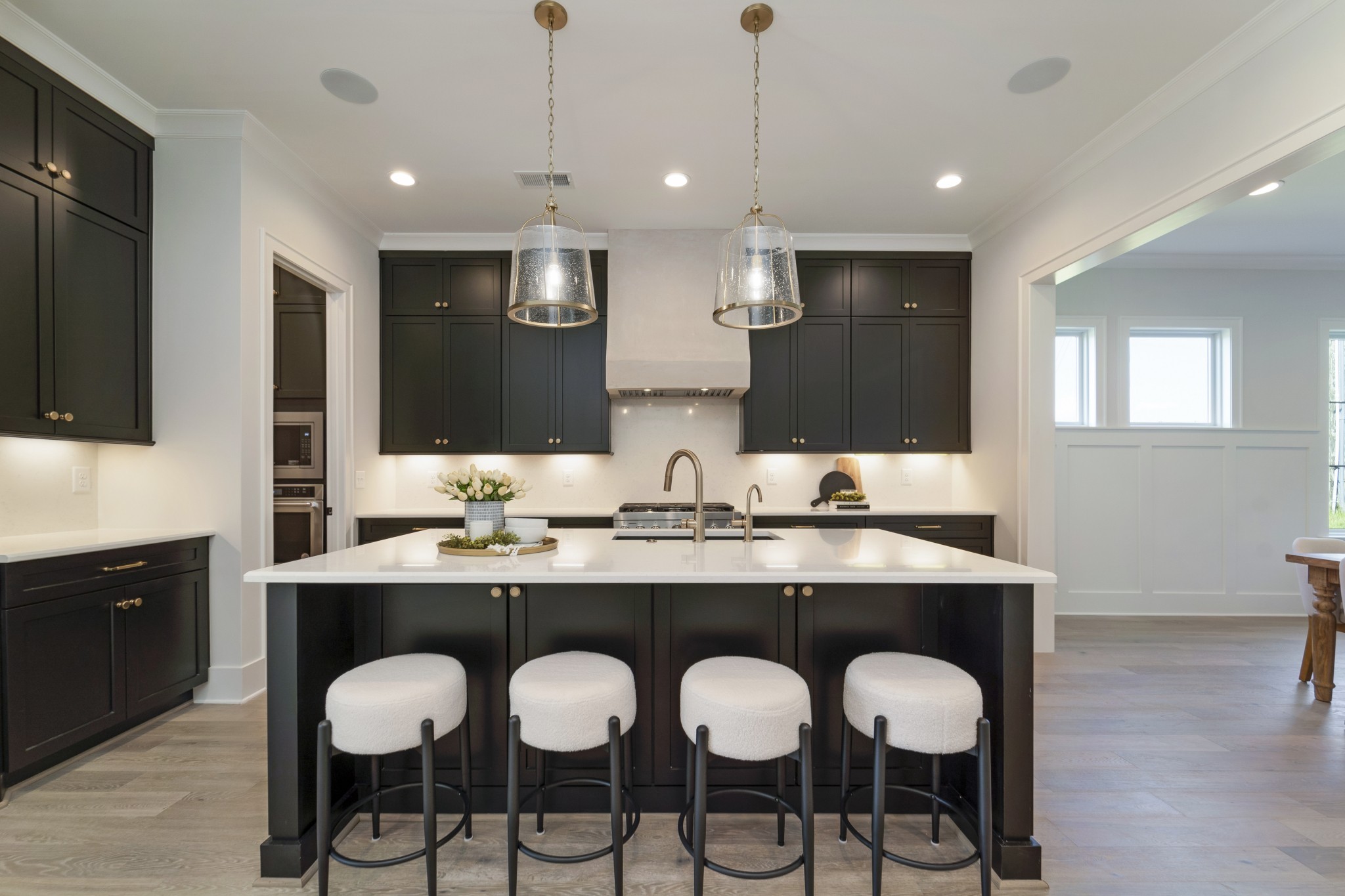 2000 Landry Place Franklin, TN 37064 - Photo 9 of 58 a kitchen with cabinets a sink dishwasher a island and chairs in it