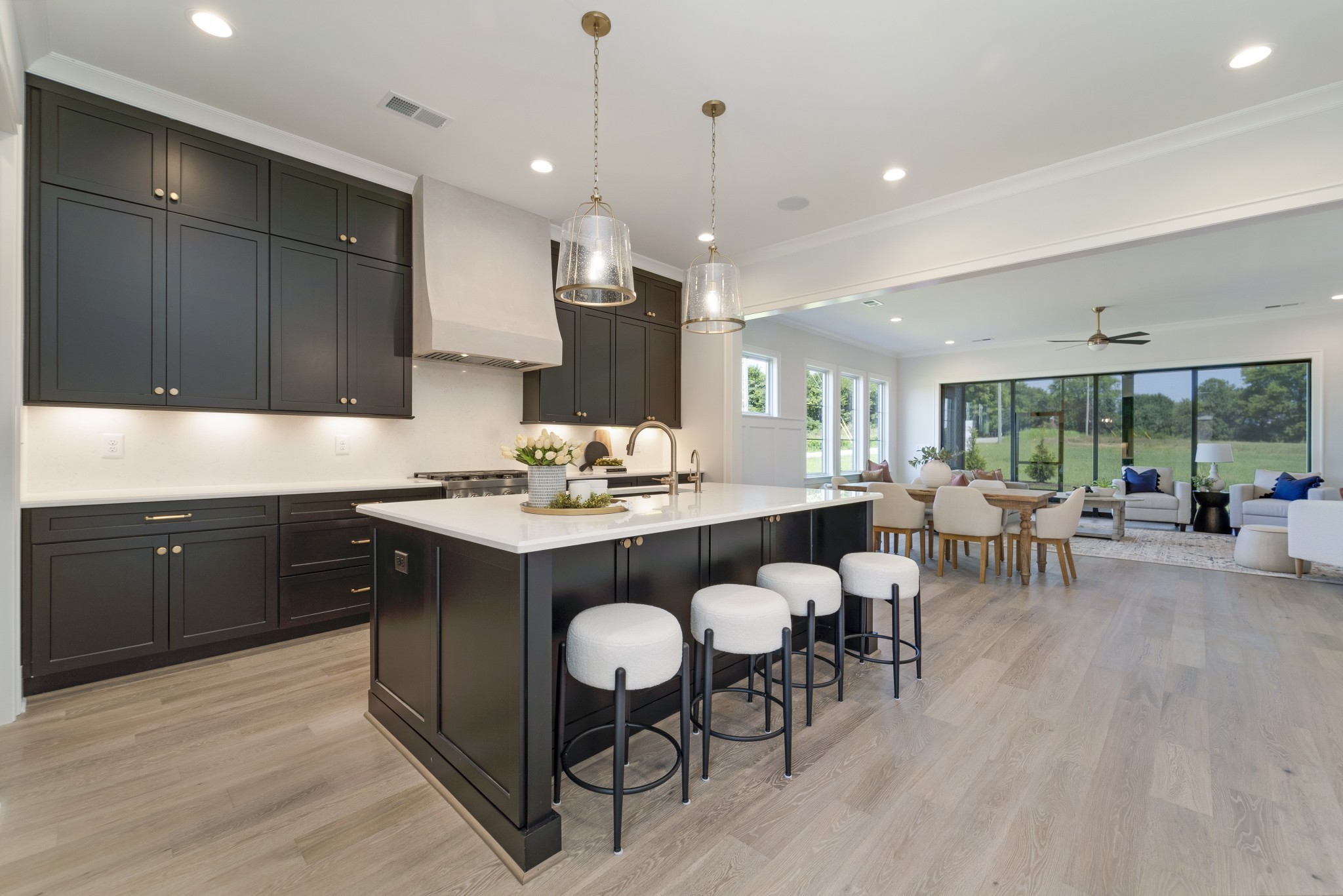2000 Landry Place Franklin, TN 37064 - Photo 10 of 58 a kitchen with a dining table chairs cabinets and stainless steel appliances