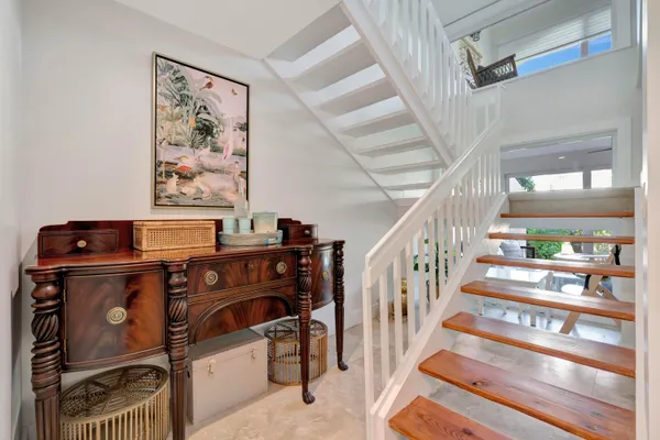 a view of an entryway with wooden floor