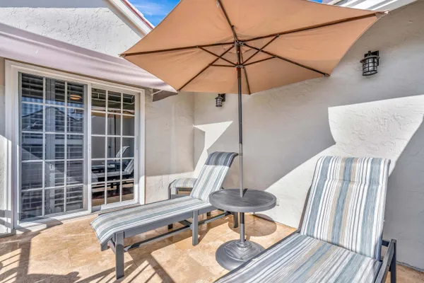 a view of balcony with furniture